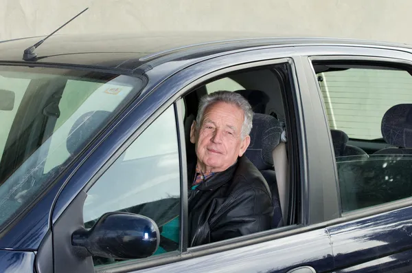 Old man in car