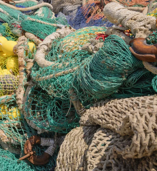 Colorful fishing nets with knots and nets closeup.