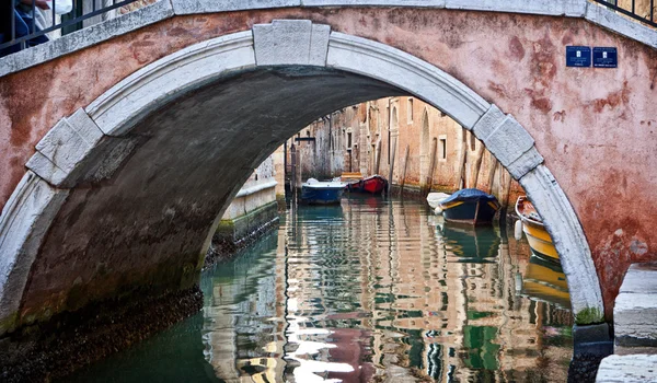 Old bridge over a Venice canal