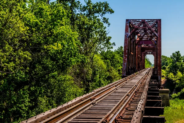 Vintage Old Railroad Trestle with Old Iron Truss Bridge Over the Brazos River, Texas.