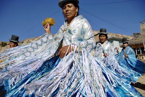 Aymara woman dance traditional dance at the festival Morenada on Isla del Sol, Lake Titicaca, Bolivia.