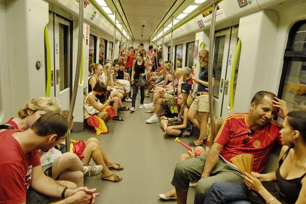 Spanish fans ride the subway to see the TV translation of the final match of the World Cup 2010 at the stadium in Valencia.