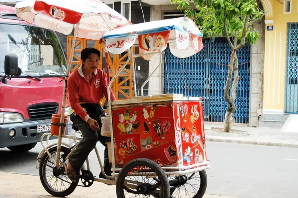 Street ice cream vendor waits his customers on a street in Can Tho, Vietnam.