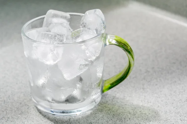 Ice cubes in glass cup