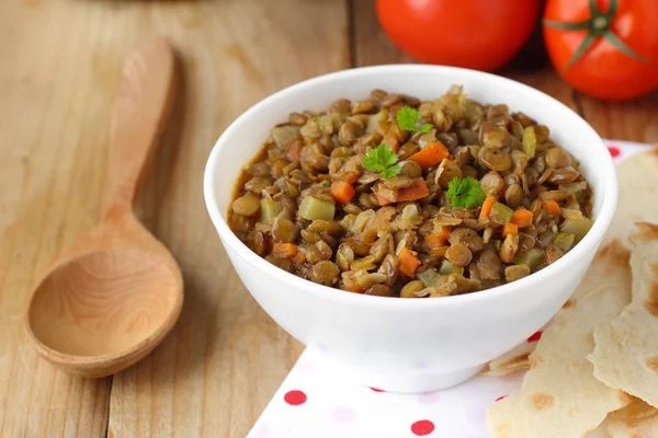 Vegan dinner - green lentils with vegetables