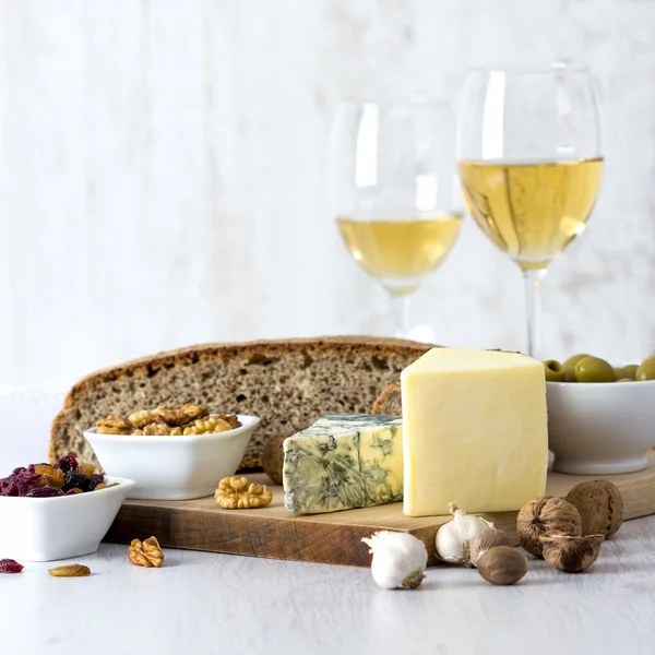 White Wine and cheese arrangement on the table