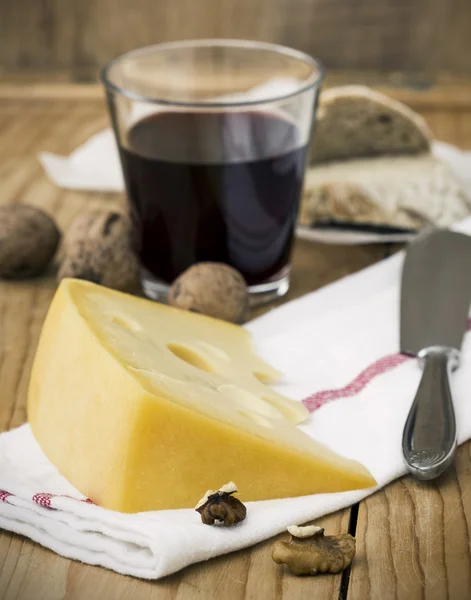 Cheese with Breads, Nuts and Wine on Table