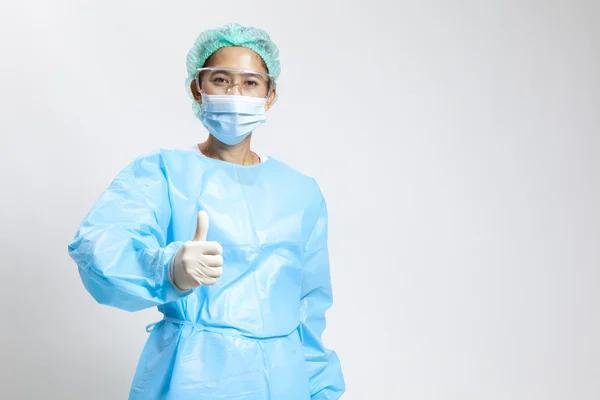 Smiling young female medical doctor with stethoscope and mask