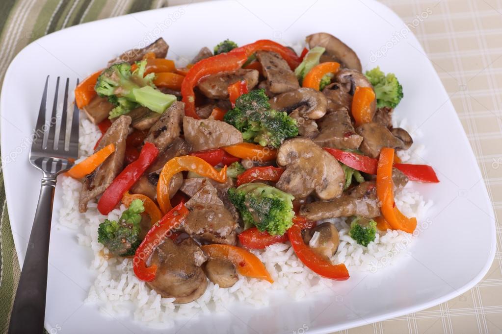 Beef Stir Fry on Rice — Stock Photo © chasbrutlag #30443077