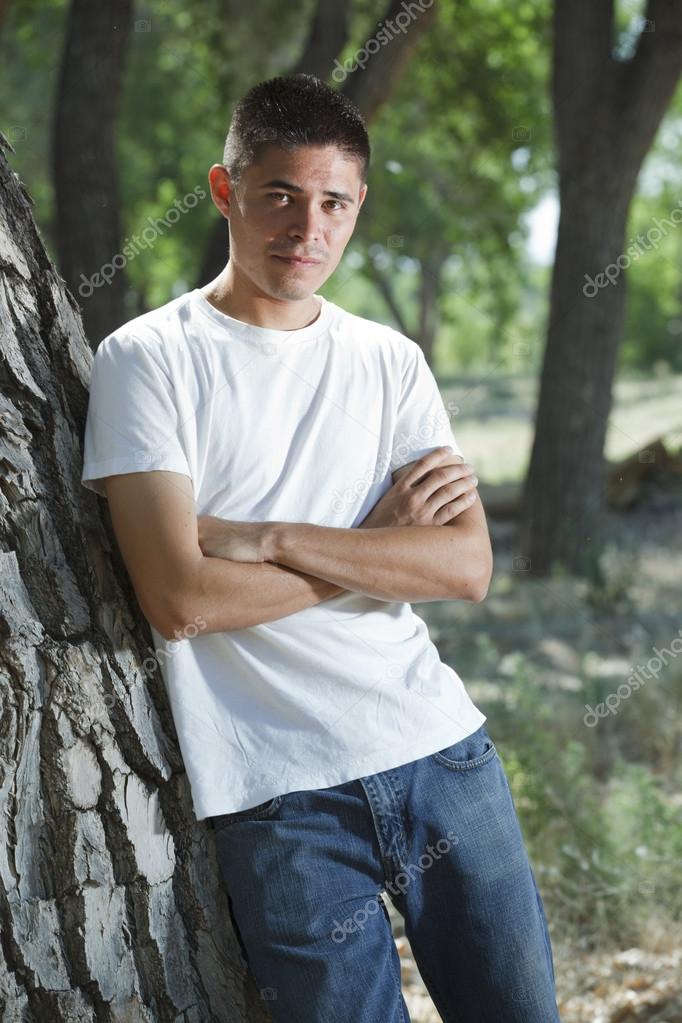 Handsome mid 20's native american man with short hair standing ... Handsome mid 20's native american man with short hair standing ...