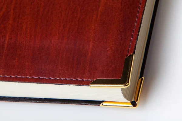 Leather cover book with metal corner