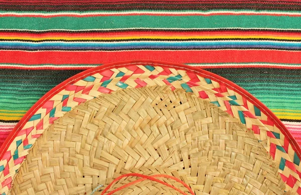 Traditional Mexican fiesta poncho rug in bright colors with sombrero