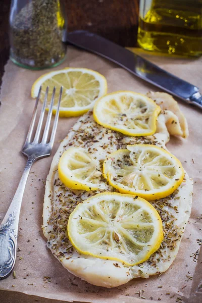 Baked fish with lemon