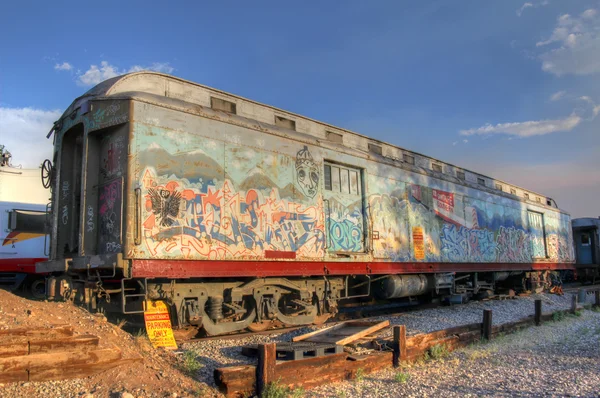 Parked train car wreck with graffity