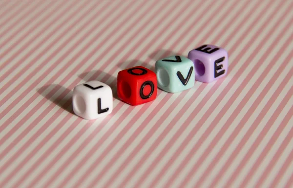 Word love is built of colored cubes