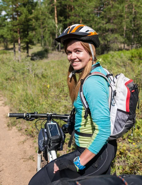 People travel by bicycle into the wilderness