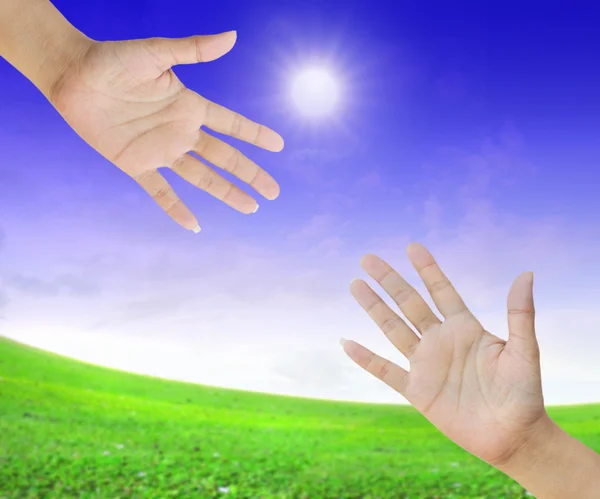 A hand is reaching out in the sky for help