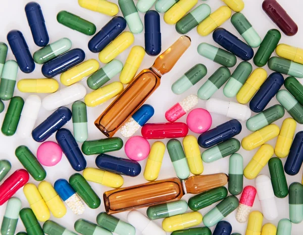 Detail a pile of colorful medicine pills