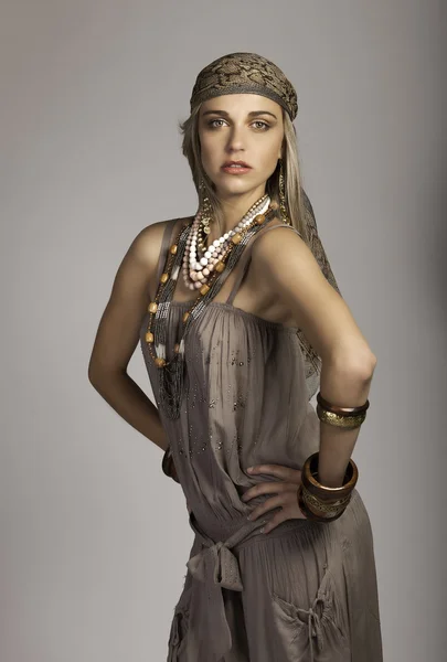 Beautiful bohemian blonde woman in safari clothing