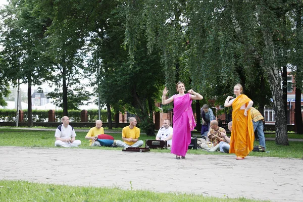 PERM, RUSSIA - JUN 10, 2012: Krishna worshipers dance in square