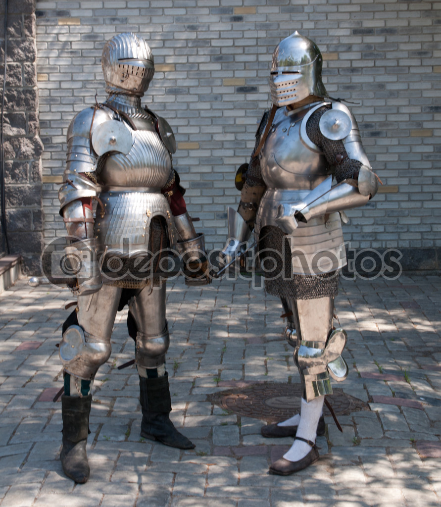 depositphotos_48021363-Two-knights-in-the-ancient-metal-armor-standing-near-the-stone-wall.jpg