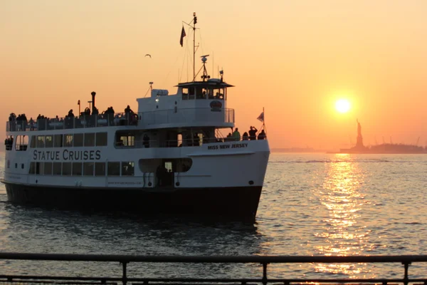 Statue of Liberty Cruise at Sunset returning back to Battery Park in New York