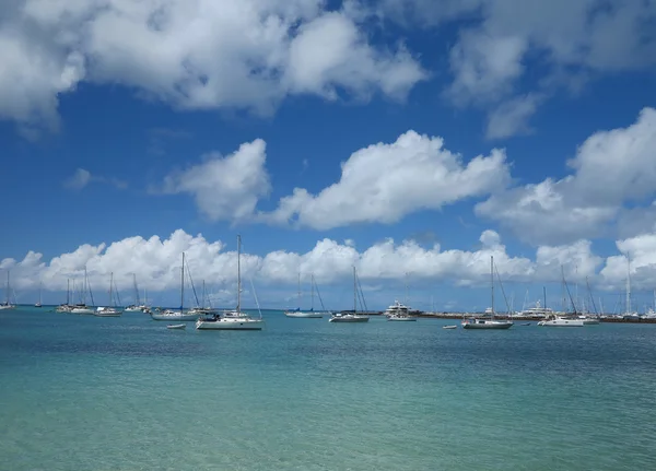 Yachts in Harbor while clouds move over Marigot in St. Martin