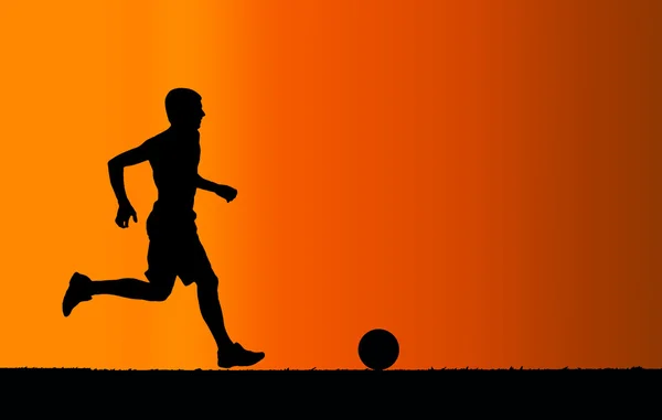 Silhouette of soccer player with a ball on orange background