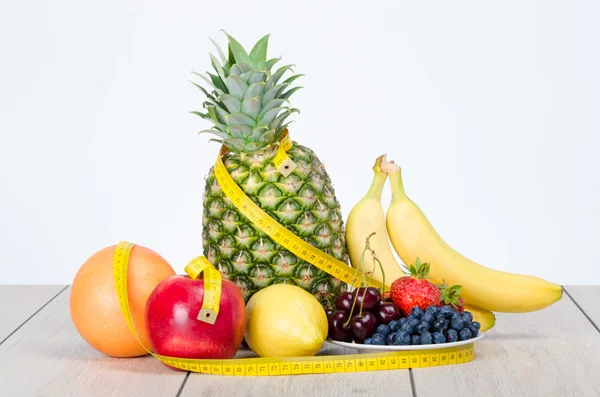 Delicious, colorful fruits and centimeter