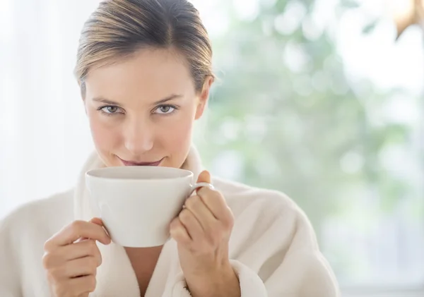 Beautiful Woman Drinking Coffee In Health Spa