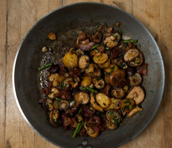 Bacon, Mushrooms and Herbs Cooked on Skillet for Dinner