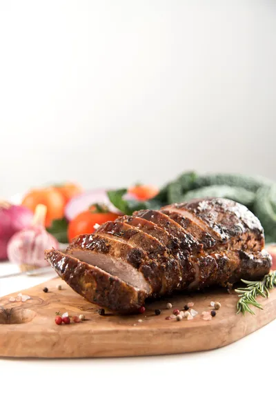 Cooked Pork Loin Roast with Vegetables and Spices