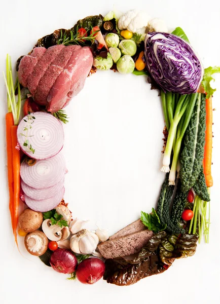 Fresh Raw Vegetables and Meats Shaped into Number Zero or Letter O