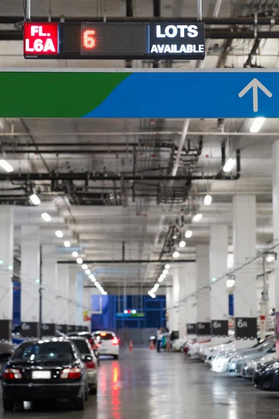 Indoor cars parking with electronic board show number of availab