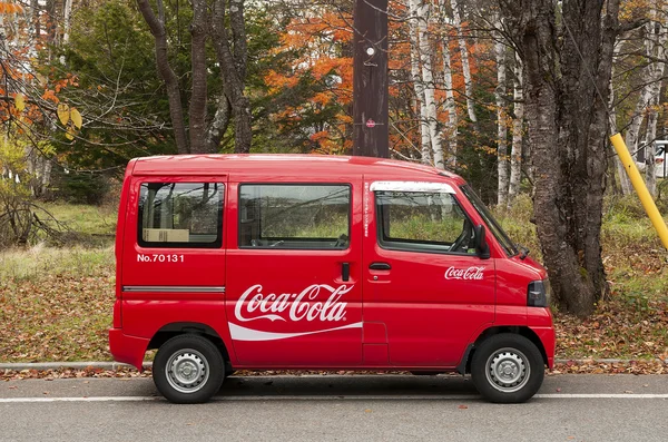 Tiny minibus delivers Coca-cola to remote locations in Japanese mountains.