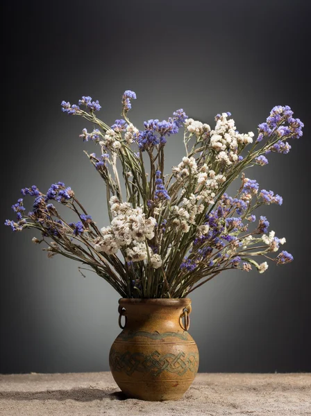 Bouquet of flowers in old vase
