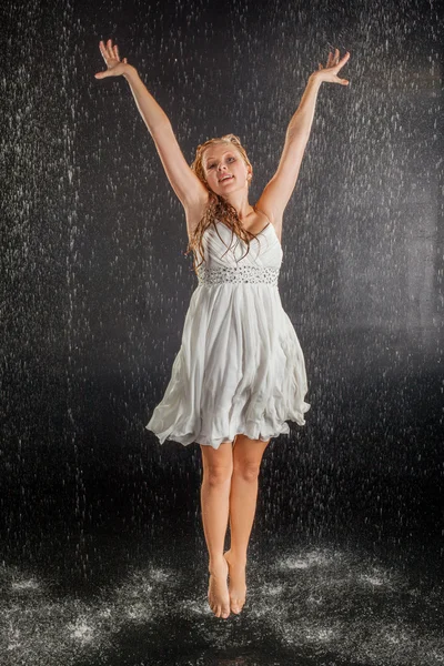 Blonde girl in dress in water studio