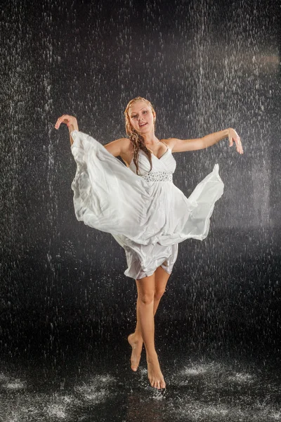 Blonde girl in dress in water studio