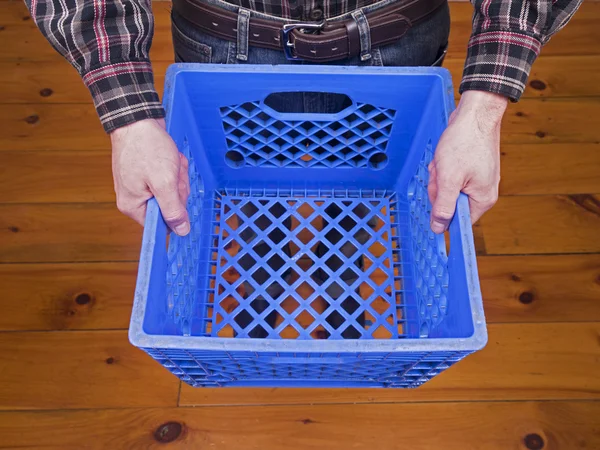 Holding Up Blue Crate