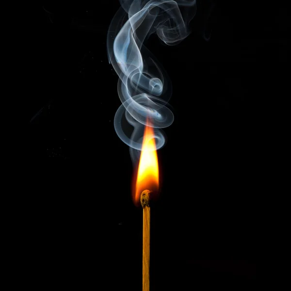 Spark of match with fire and smoke