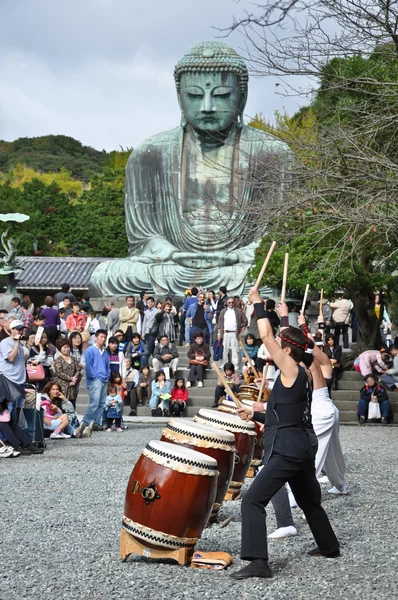 Drum show in front of Big Buddha at Kamakura, Japan