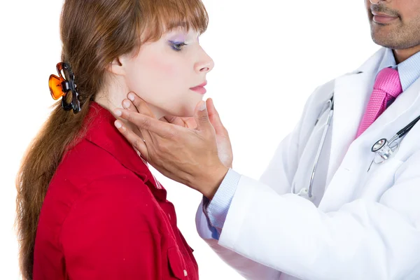 A close-up cropped image of a doctor, endocrinologist performing physical exam, palpation of the thyroid gland