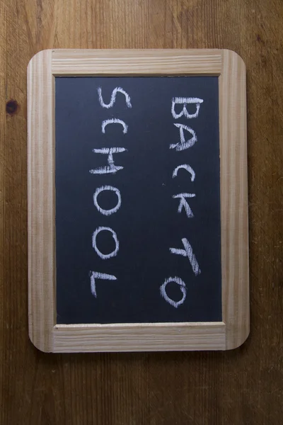 Back to school, written on replica old blackboard writing slate