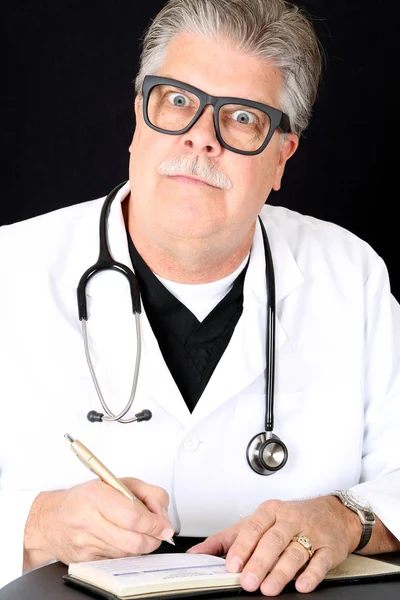Hilariously funny medical doctor huge eyes writing prescription
