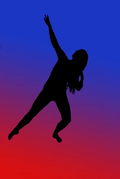 Silhouette of fit young woman dancing with red and blue backgrou