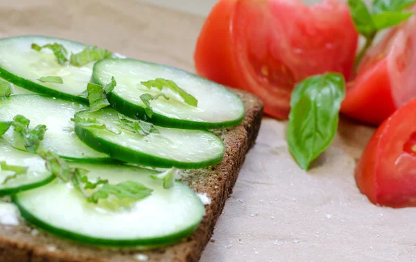 Cucumber sandwich with tomato and mint and basil