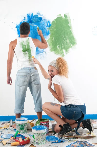 Couple painting at home