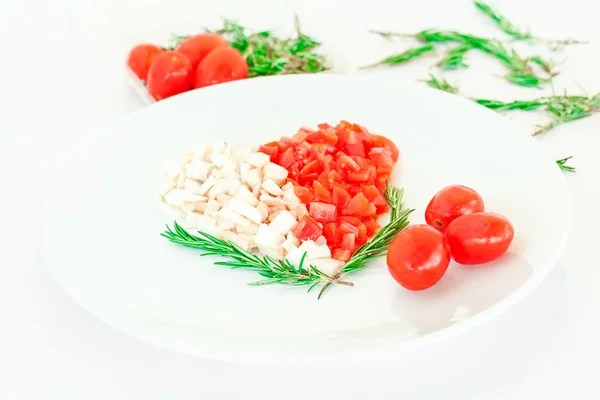 Tomato and mushroom on plate in the shape of heart