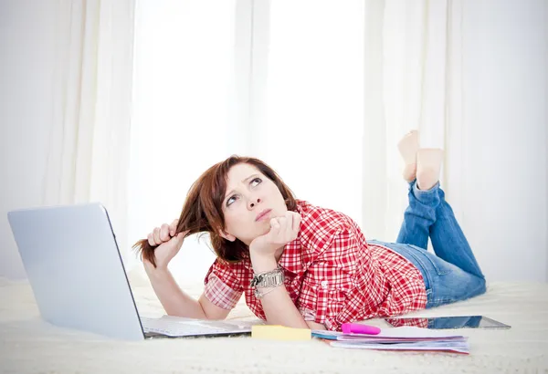 Business woman, student lying down looking up thinking