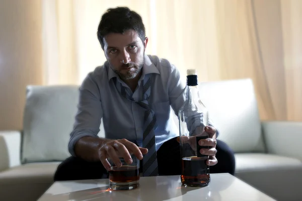 Drunk business man wasted and whiskey bottle in alcoholism